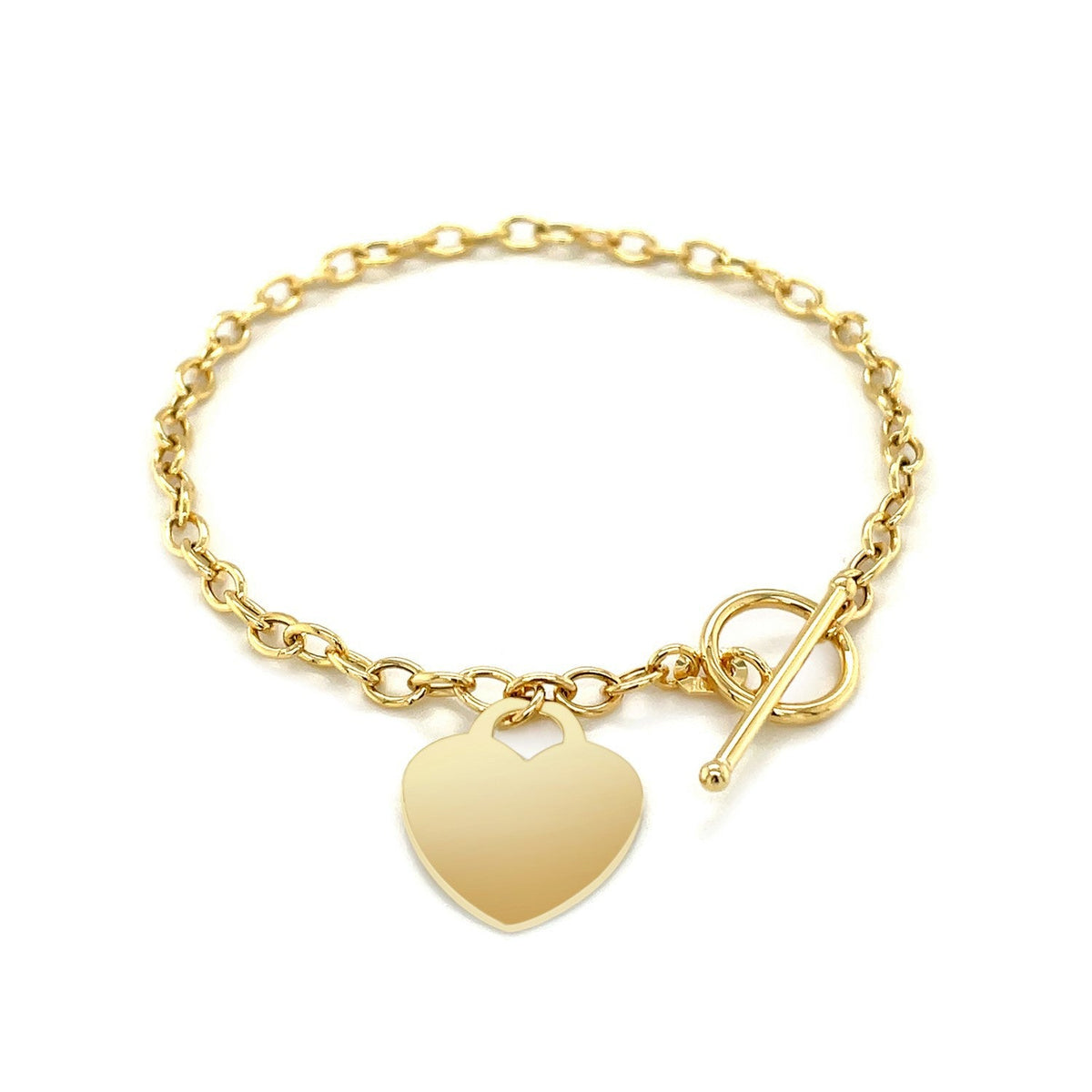 Pulsera de eslabones con cierre de palanca y dije de corazón en oro amarillo de 14k