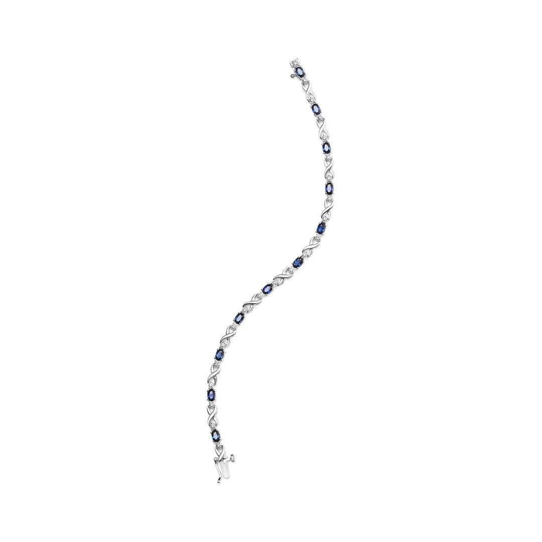 10K White Gold 5x4mm Oval Sapphire Gemstone and 1/10 Cttw Diamond Prong Set "X" Link Bracelet - Size 7" (H-I Color, SI1-SI2 Clarity)
