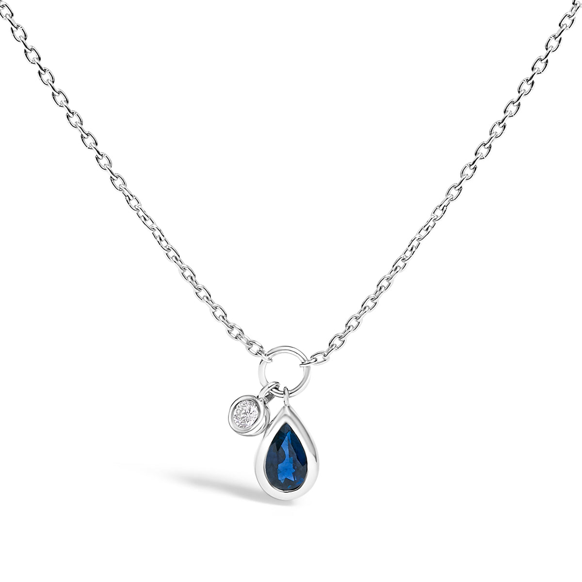 Collar con dije de zafiro azul pera de 6x4 mm y detalles de diamantes en oro blanco de 10K - 18 pulgadas