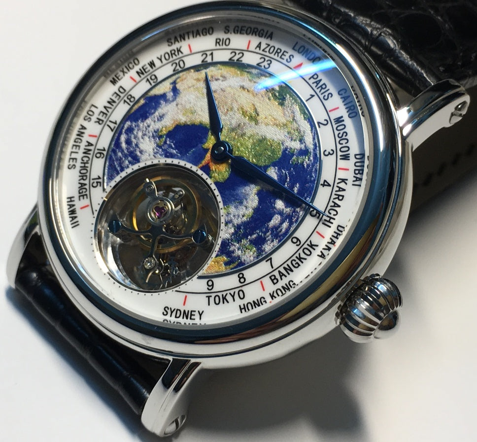 A luxurious round sapphire watch with a globe design in the center, showcasing a world time feature, accompanied by a leather band.