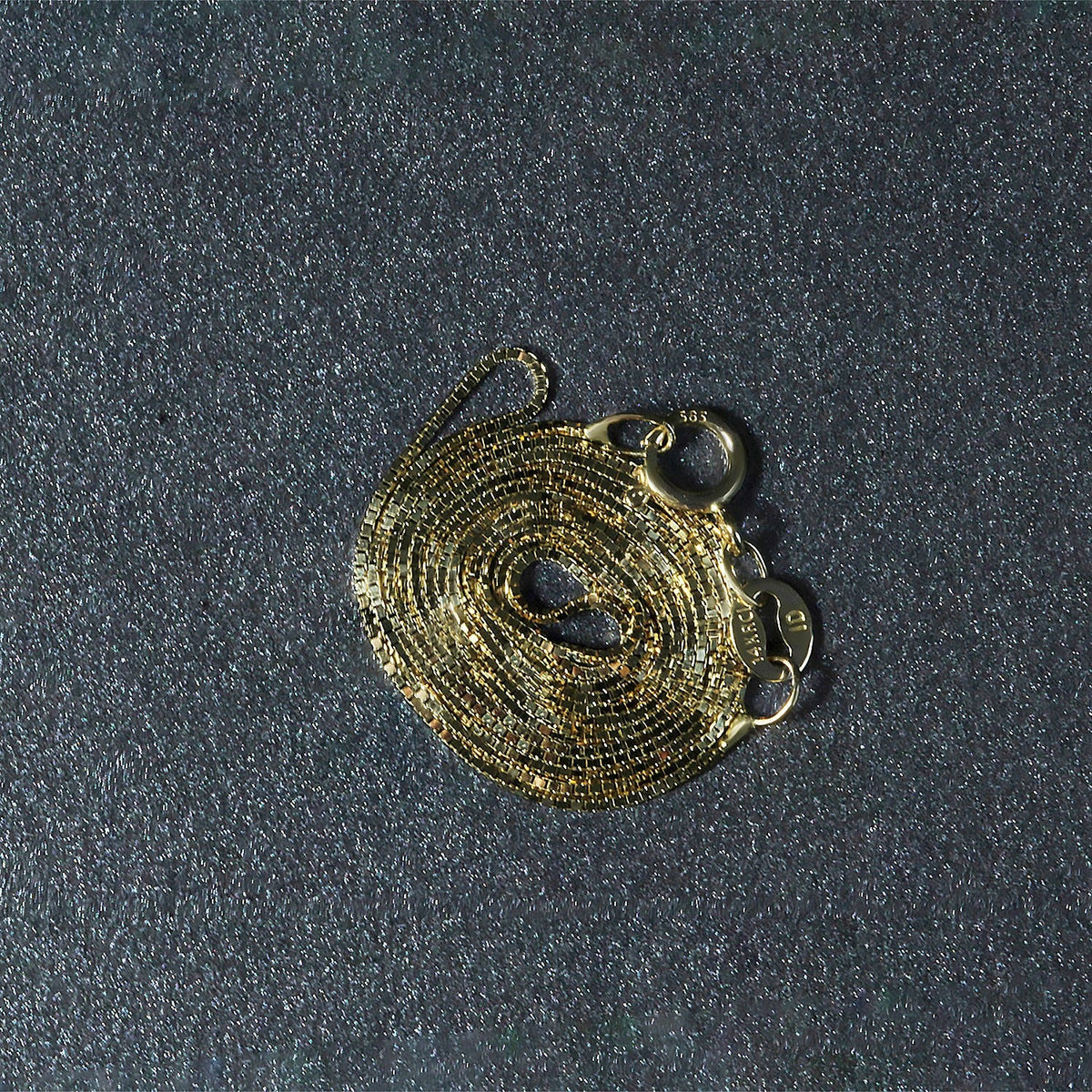 Cadena clásica de oro amarillo de 14k y 0.6mm