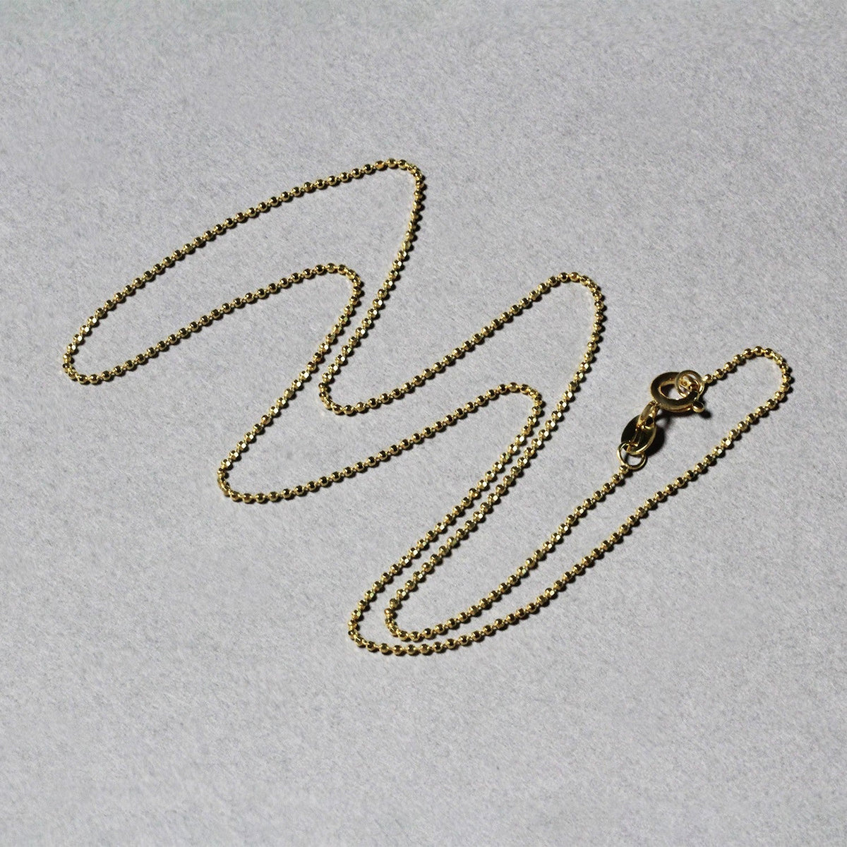 Cadena de oro amarillo de 14k de 1.0mm con cuentas facetadas