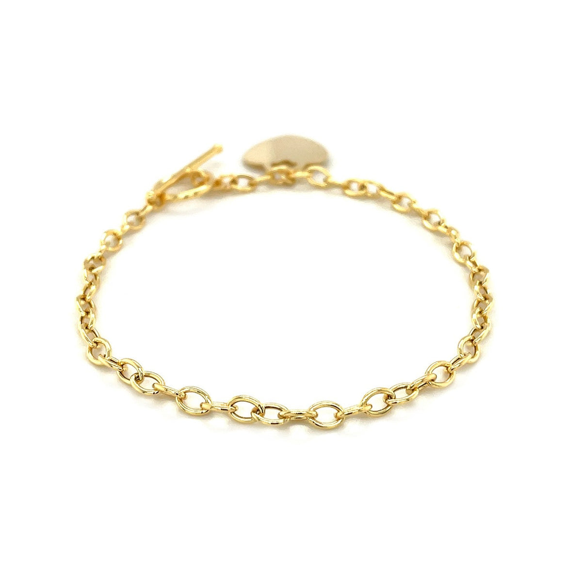 Pulsera de eslabones con cierre de palanca y dije de corazón en oro amarillo de 14k