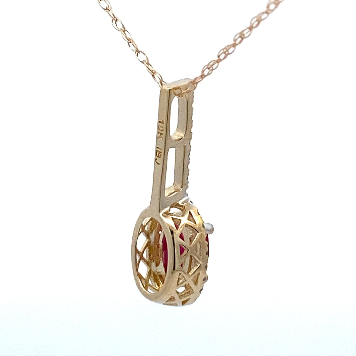 Colgantes de moda de rubí y diamantes de .45ct en oro amarillo de 10kt