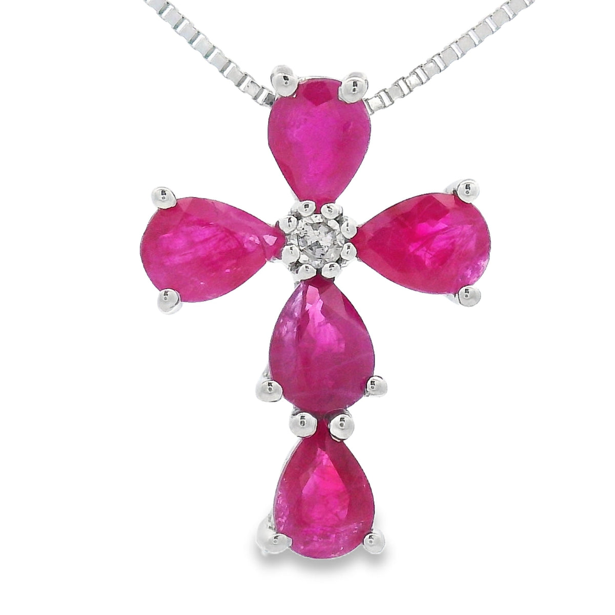 Colgante religioso de cruz con rubíes y diamantes de oro blanco de 10 quilates