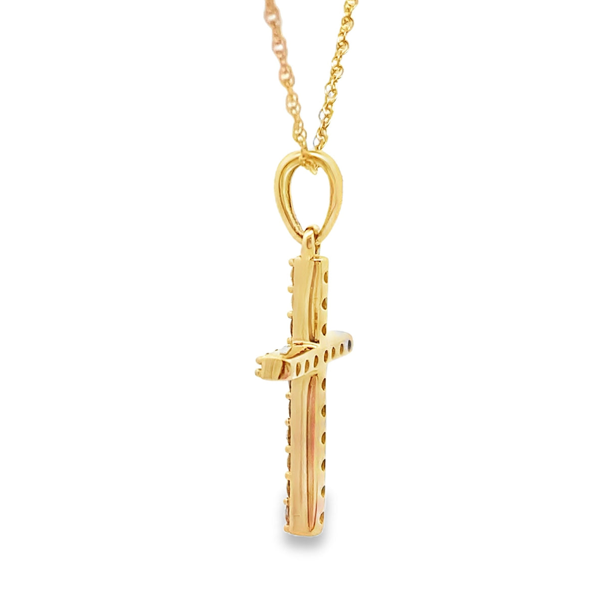 Colgante religioso de cruz con diamantes de .13 ct en oro amarillo de 14 K