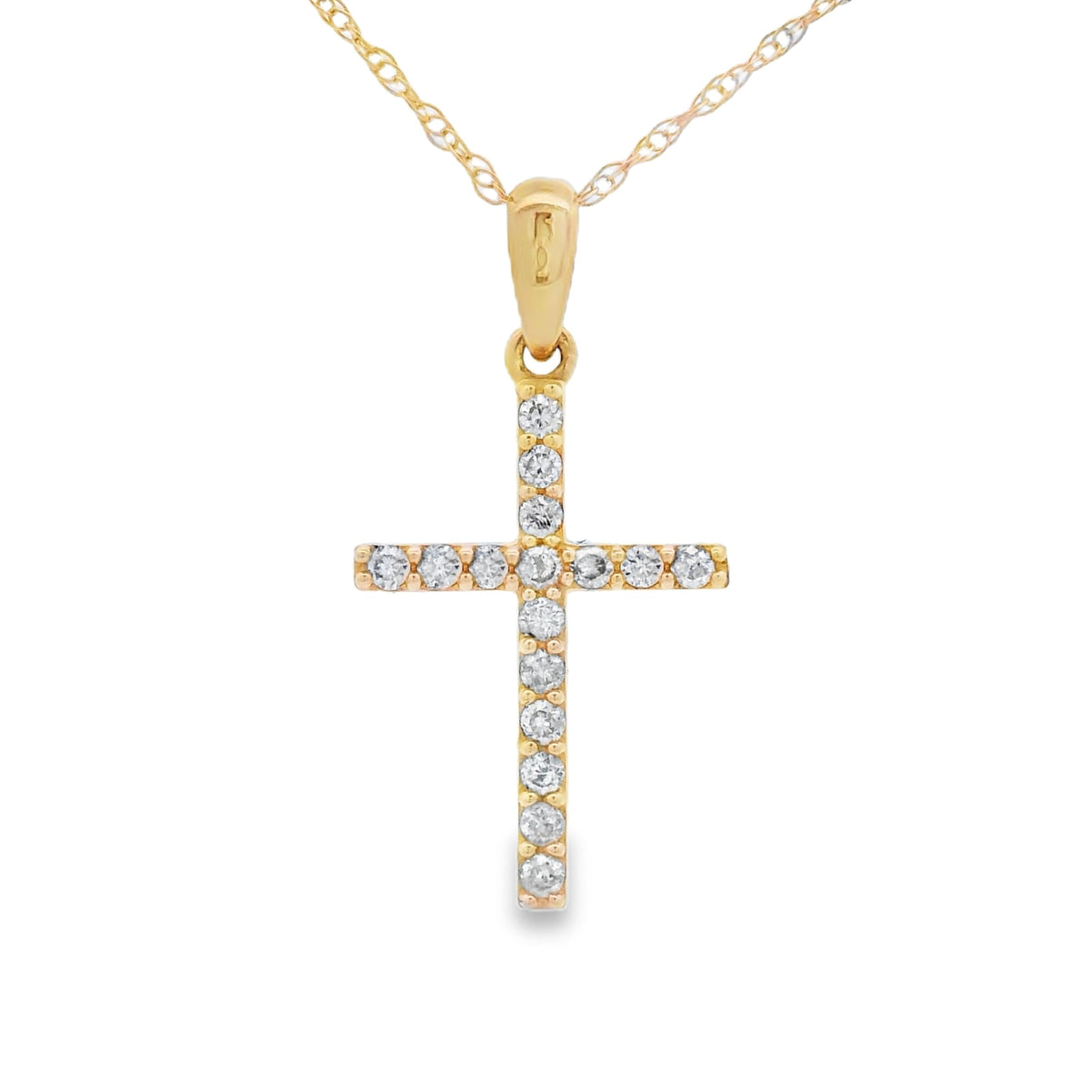 Colgante religioso de cruz con diamantes de .13 ct en oro amarillo de 14 K