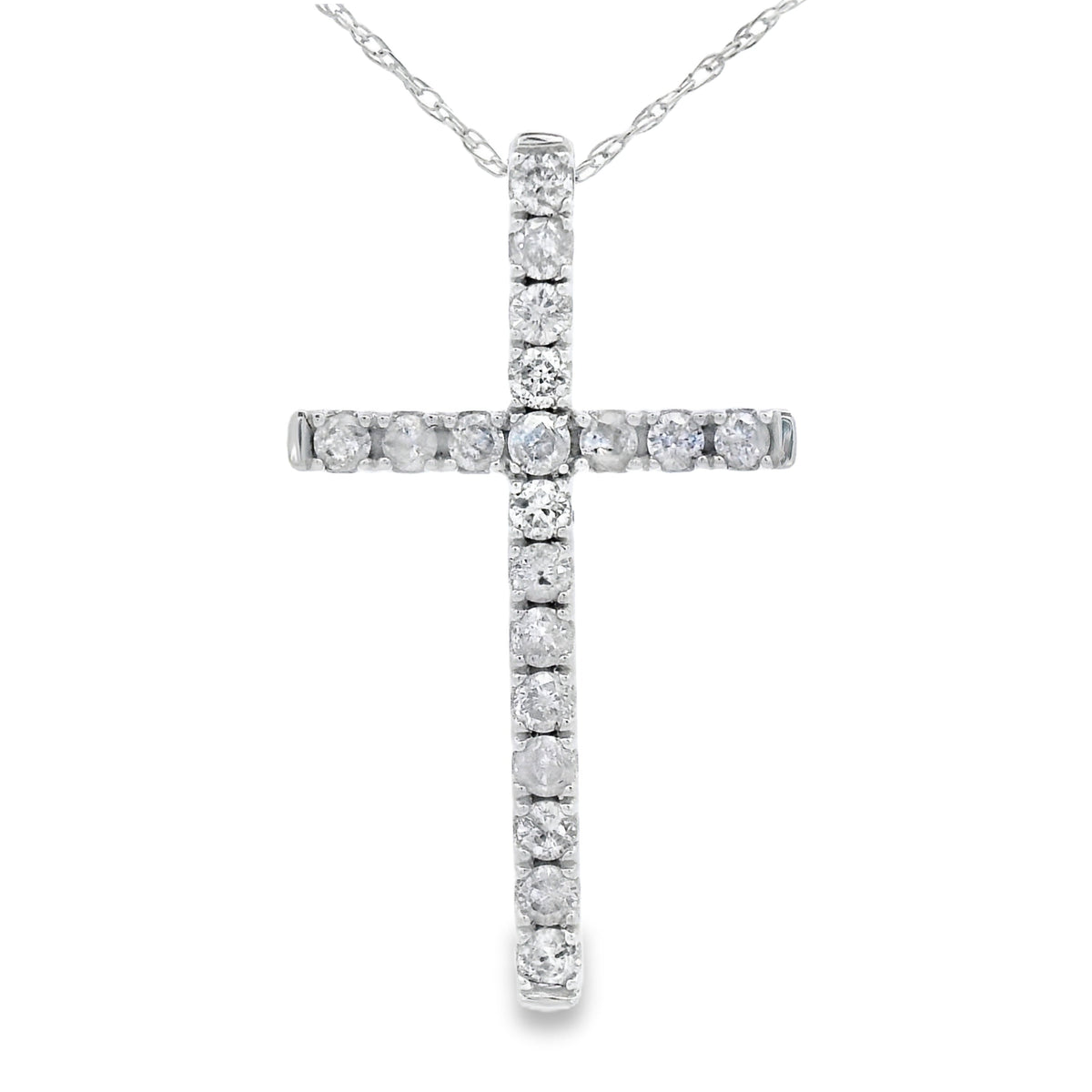 Colgante de cruz religiosa con diamante de .33 ct en oro blanco de 14 kt