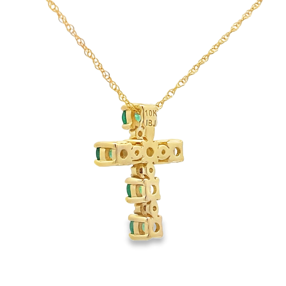 Colgante religioso de cruz con esmeralda de 0,26 ct en oro amarillo de 10 qt