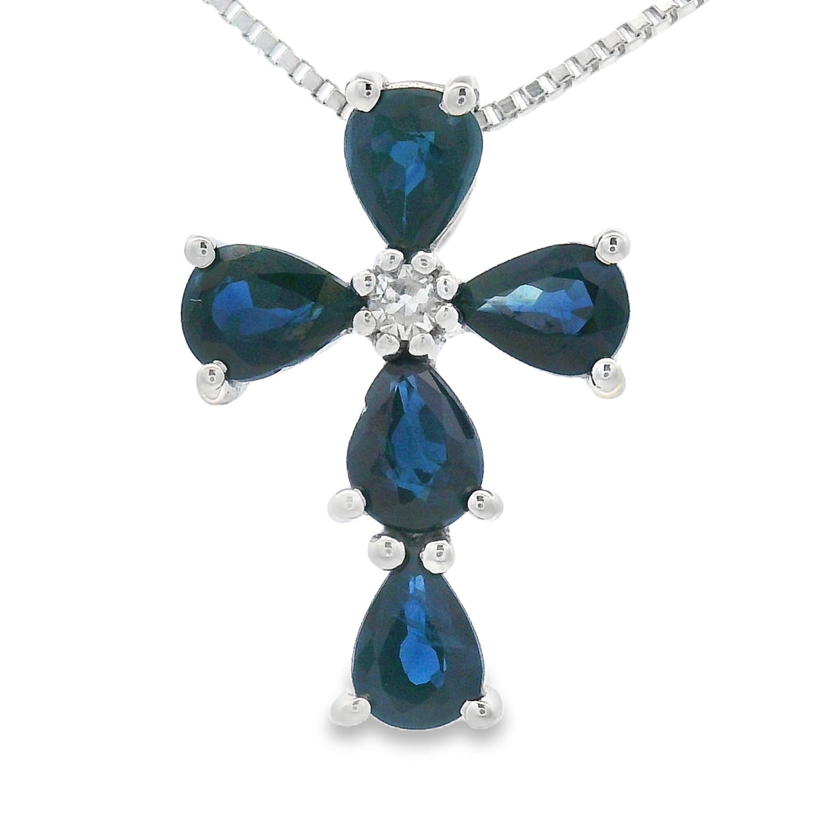 Colgante Religioso Cruz con Zafiro de .82ct en Oro Blanco de 10KT