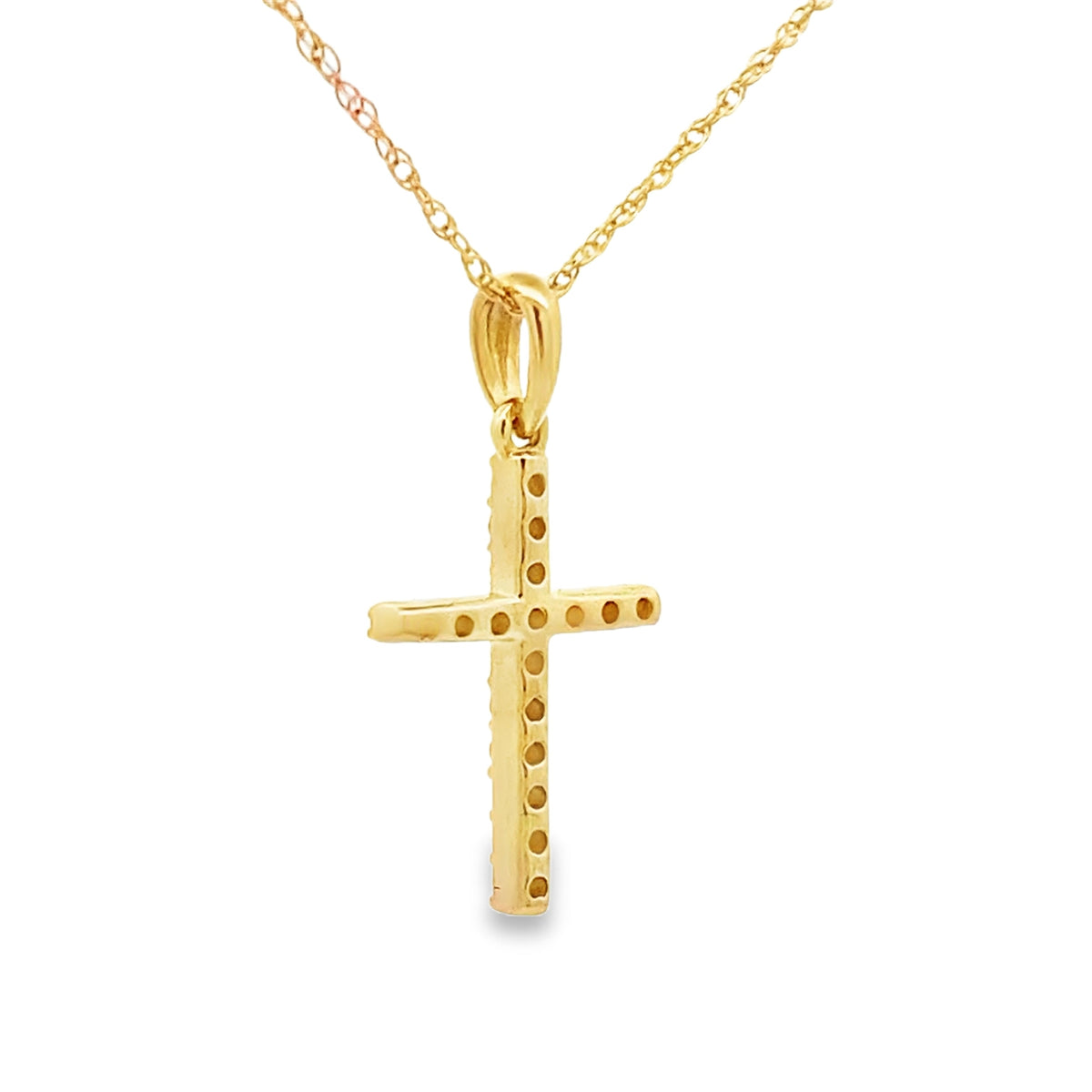 Colgante de cruz religiosa con diamante de .11 ct en oro amarillo de 14 kt