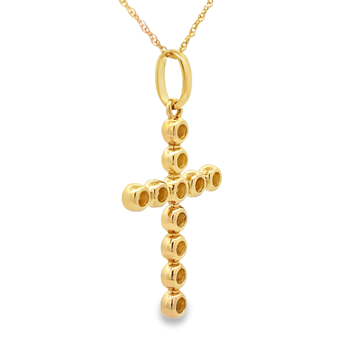 Colgante religioso de cruz con diamante de .31 ct en oro amarillo de 14 kt