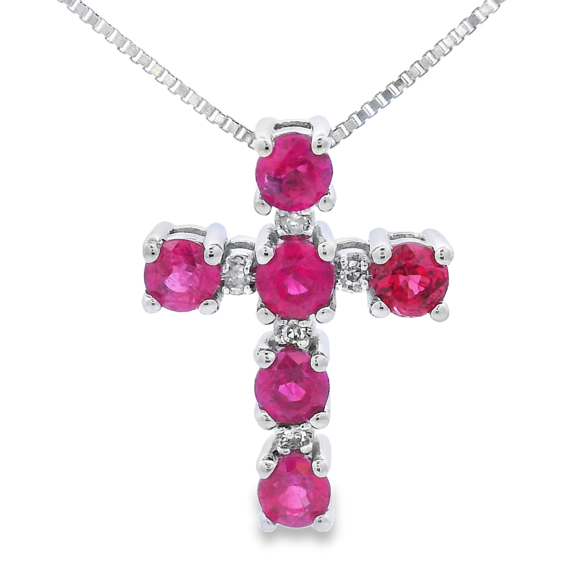 Colgante religioso de cruz con rubíes y diamantes de oro blanco de 10 quilates