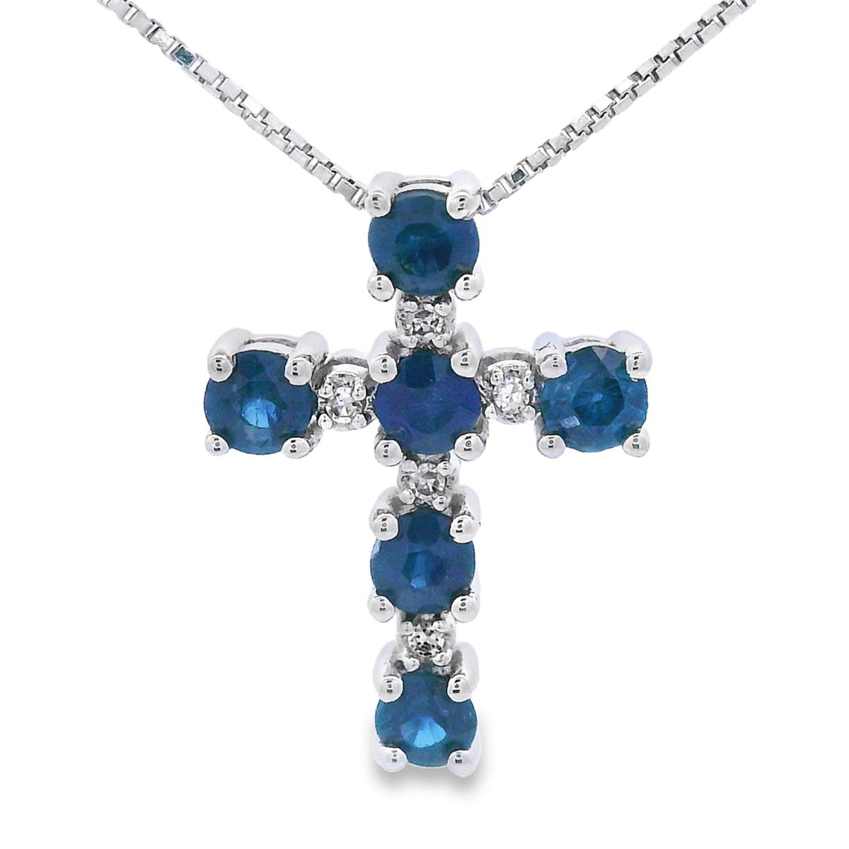 Cruz religiosa con zafiro de 0,32 ct, colgante de oro blanco de 10 kt