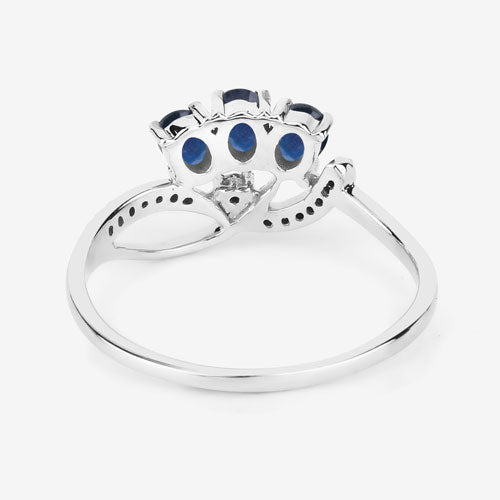 Anillo de oro blanco de 14K con zafiro azul genuino de 0,65 quilates y diamantes blancos