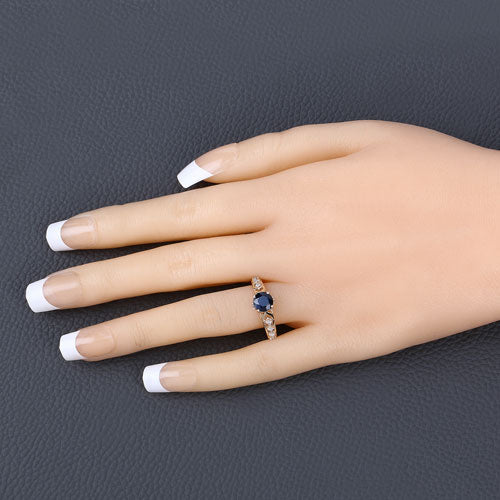 Anillo de oro amarillo de 10 quilates con zafiro azul auténtico de 1.13 quilates y diamantes blancos