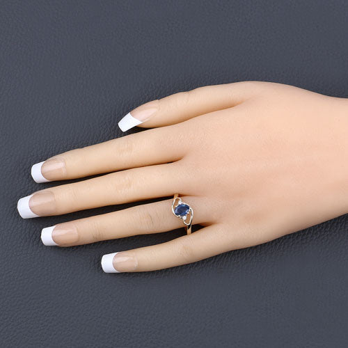 Anillo de oro amarillo de 10 quilates con zafiro azul genuino de 0,98 quilates y diamantes blancos